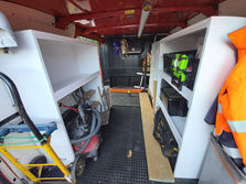 a vacuum cleaner is sitting in the back of a van