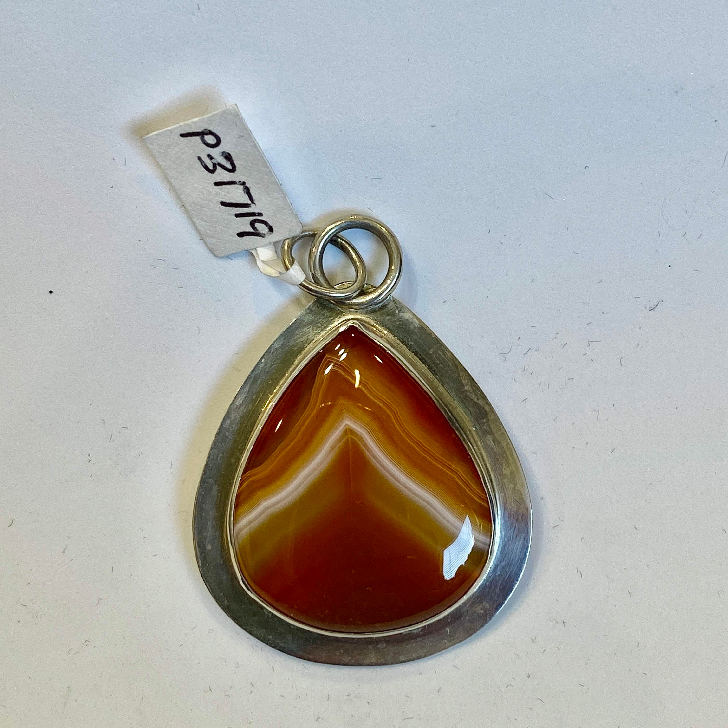 Sterling silver pendant with a Banded Botswana Carnelian Agate cabochon.