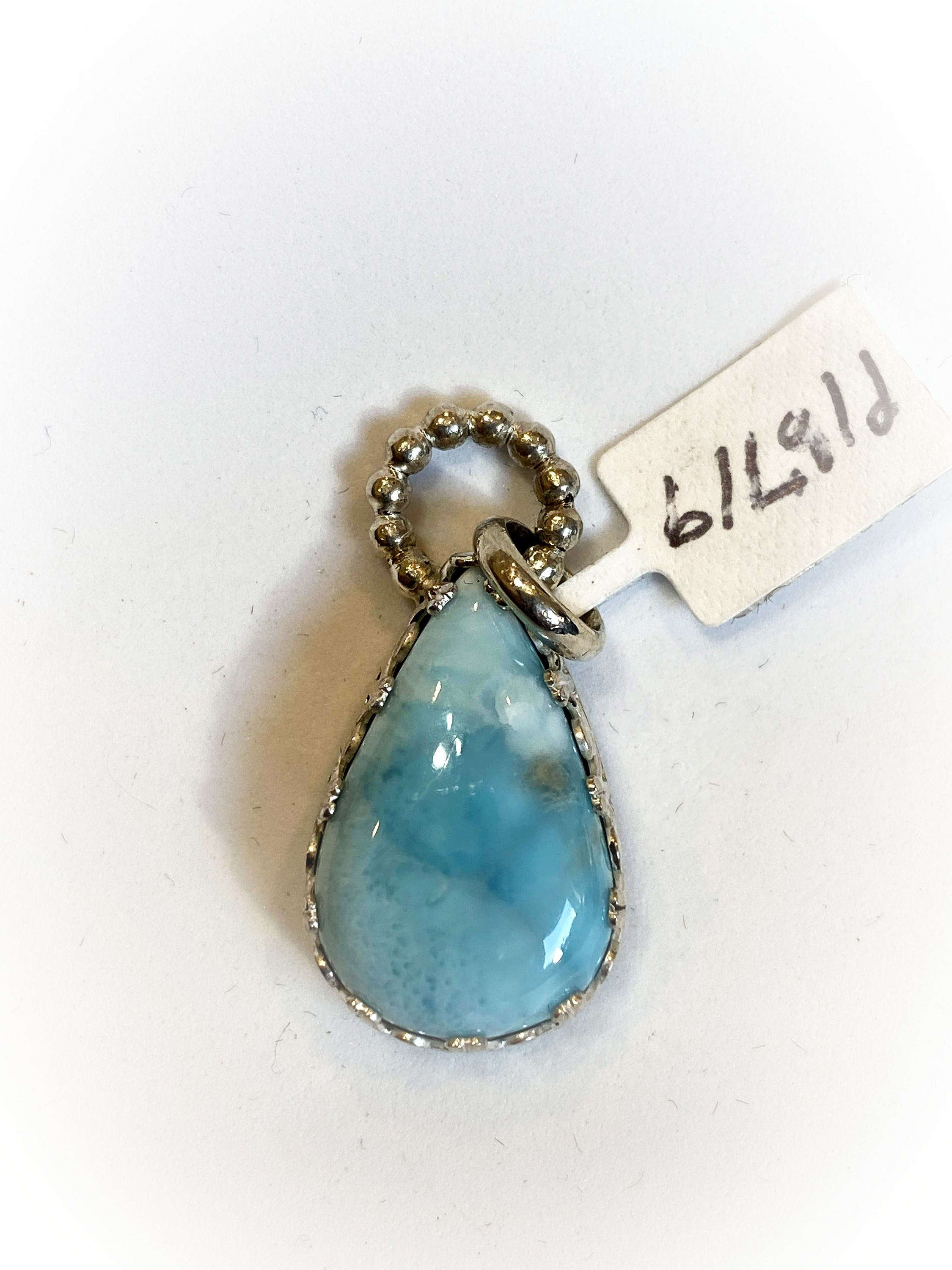 Sterling silver pendant with a Larimar cabochon.