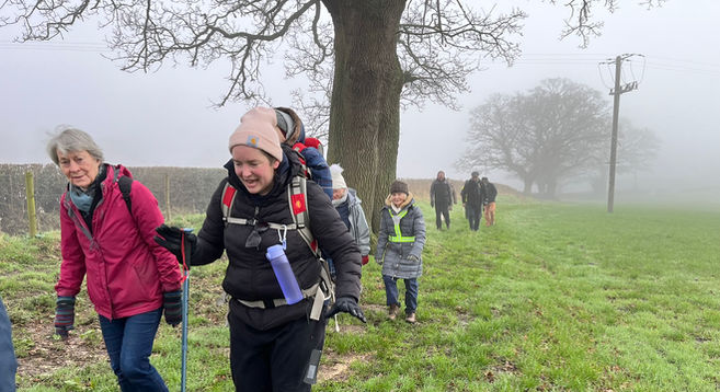 Group of walkers in the mist