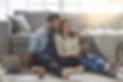 Hispanic couple sitting on the floor looking at codependency factors