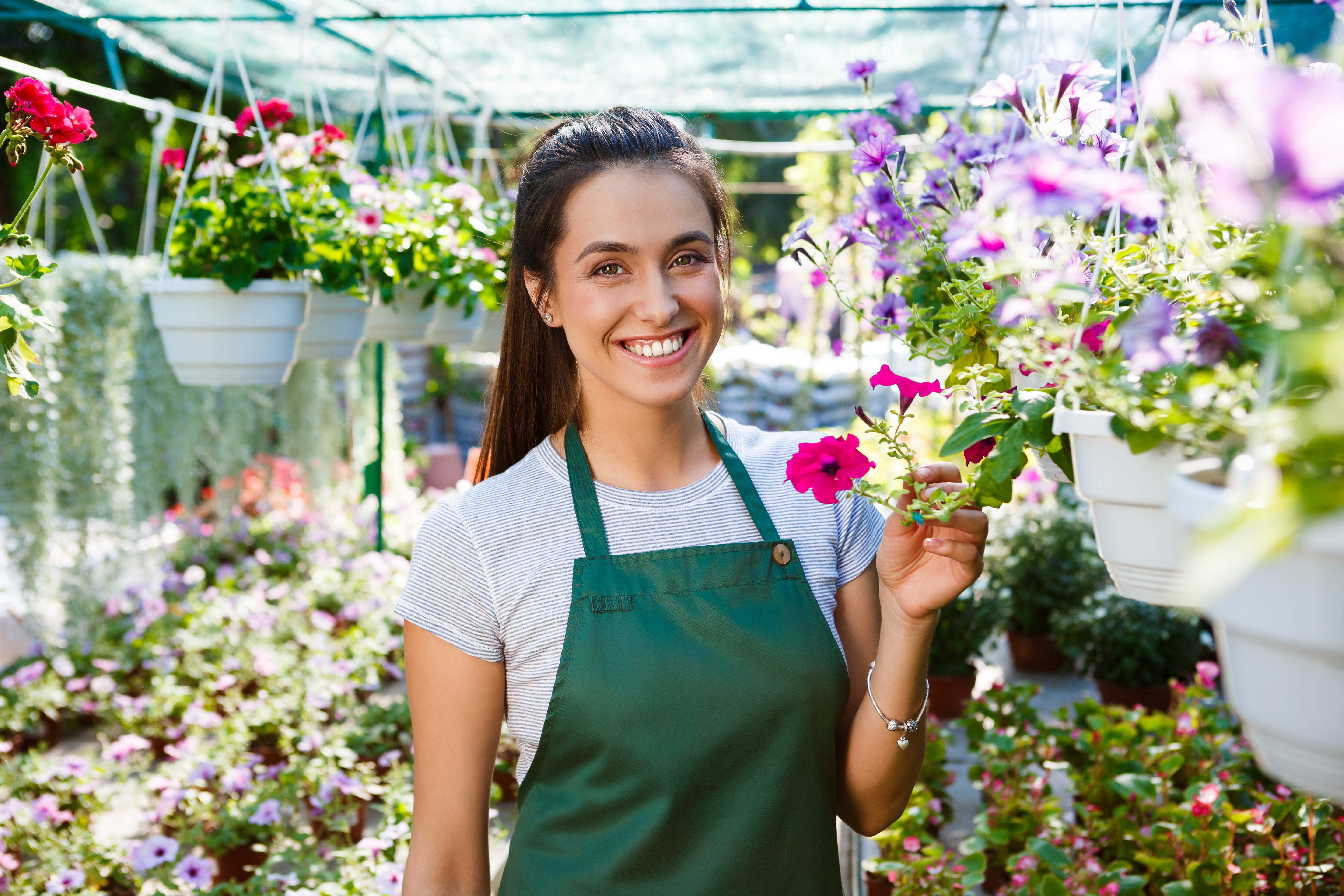 young-beautiful-florist-posing-smiling-flowers.jpg