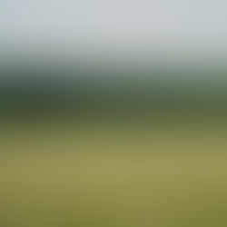Tractor working in a British field in the South Downs; contextual Unsplash image illustrating on-farm trials, not a funded grant project.