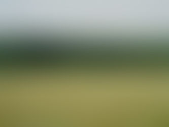 Tractor working in a British field in the South Downs; contextual Unsplash image illustrating on-farm trials, not a funded grant project.