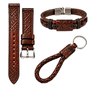 Set of Moroccan leather accessories in brown hide, including an embossed watch strap, a braided bracelet with metal clasp, and a braided keychain loop with metal ring.