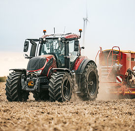 Sixth-generation Valtra T Series tractor working in a field