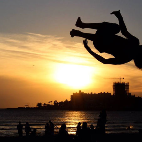Parkour athlete in mid-air, illustrating Marrakech Parkour Day