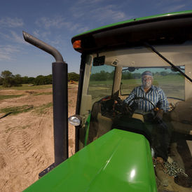 Tractor working an agricultural field in the United States