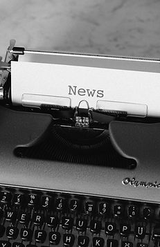 black and white typewriter on black tabl