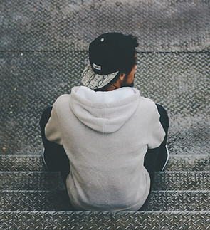 Man Sitting on Stairs