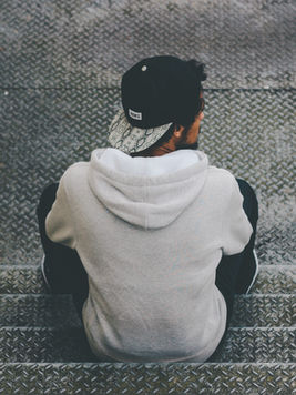 Man Sitting on Stairs