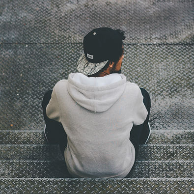 Man Sitting on Stairs