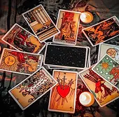 tarot-reading-with-tarot-card-background-and-candlelight-on-the-table-for-astrology-occult