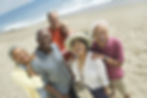 A photo of Black, Asian and Caucasian people at the beach.
