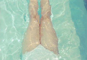 woman in white monokini in swimming pool_edited.jpg