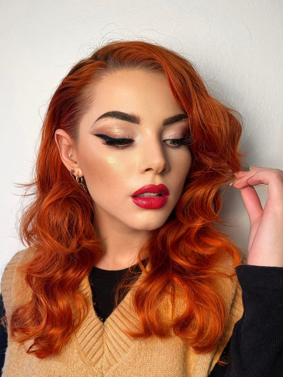 Woman with red hair and makeup looks at the camera, Mugshot Makeup Artist.