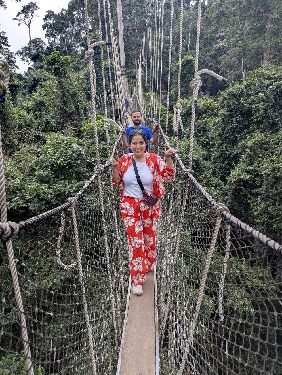Visitor crossing the canopy walkway at Kakum National Park
