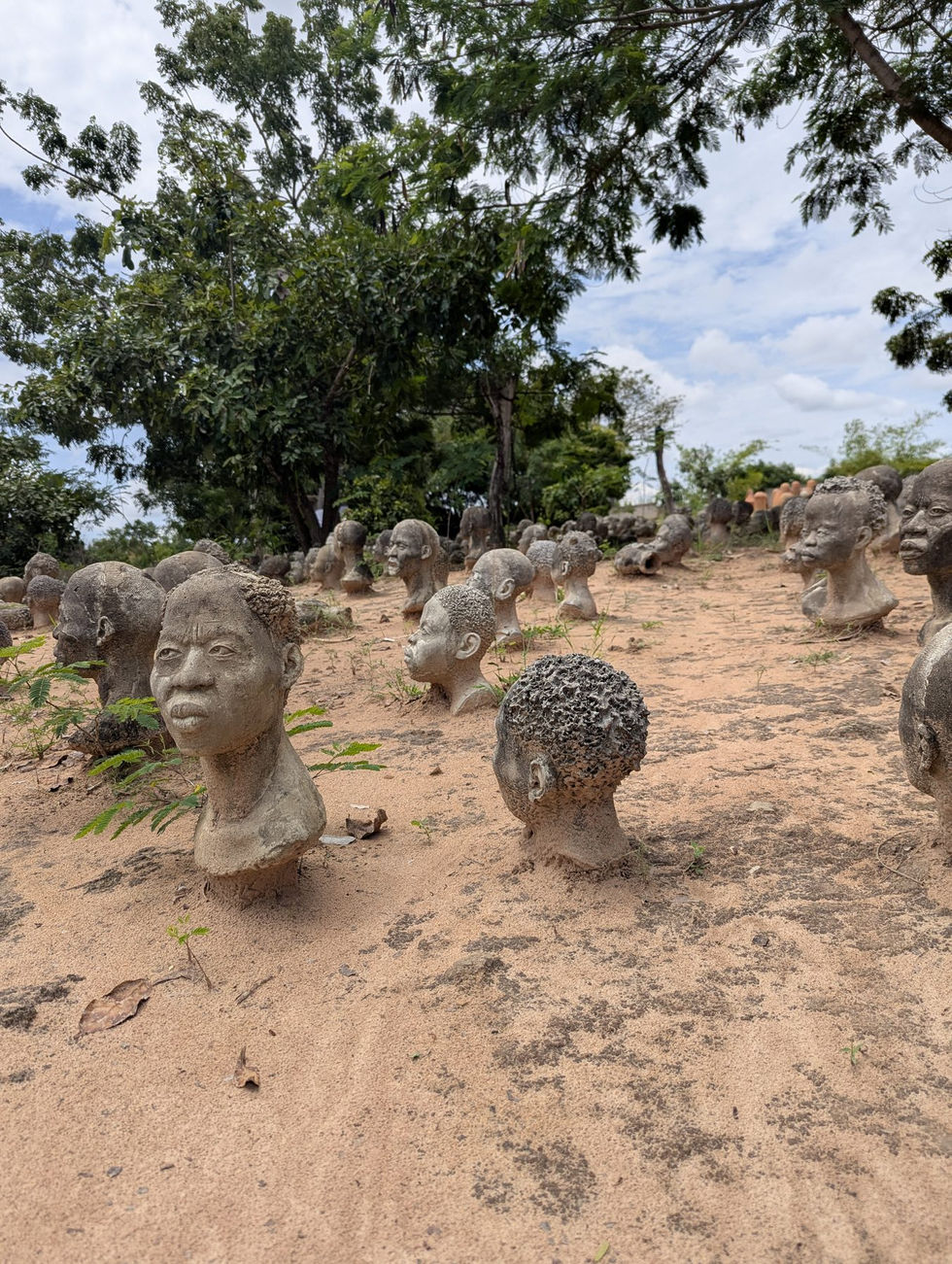 Sculpture garden at Nkyimkyim Museum in Ada, Ghana