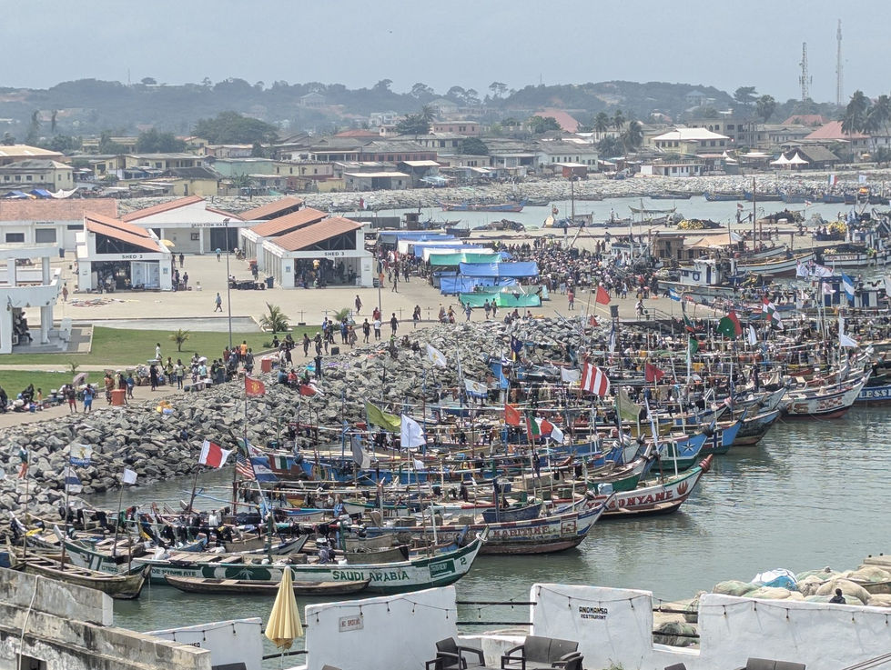 Fishing boats in Elmina harbour viewed from the castle