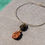 Thumbnail: 'Wrapped sea Pebbles rigid necklace'