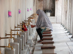 muslim woman washing before prayer