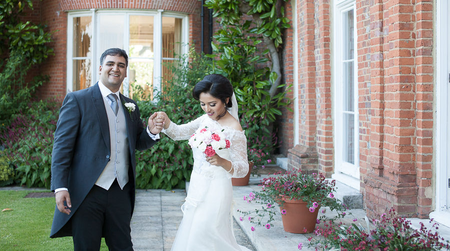The bride and groom after their wedding at The Grove, Watford, by wedding photographer Taz Rahman