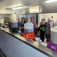 Perspektiv team bottling and labeling olive oil