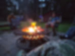Guests sitting by the campfire