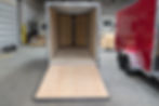Open rear ramp door of cargo trailer