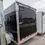 Thumbnail: Rear of black enclosed cargo trailer