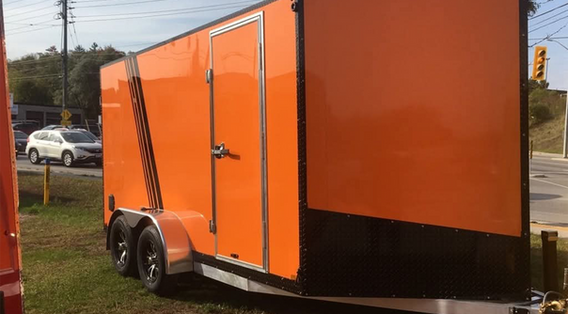 Two-tone enclosed tandem axle cargo trailer