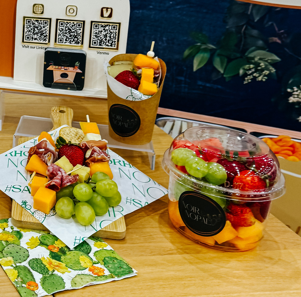 Noir & Nopal fruit and charcuterie cups and boxes with grapes, strawberries, cheese, and cured meats