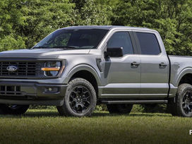 2027 Ford F-150 Crew Cab in Carbonized Gray parked on grass