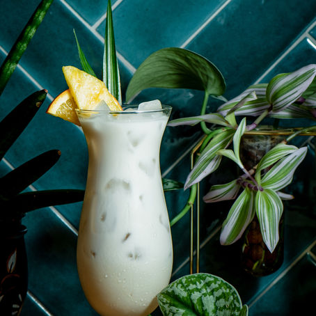Unleash the Tropical Vibes with July's Legendary Piña Colada: Sip, Sway, and Conquer the Beach!