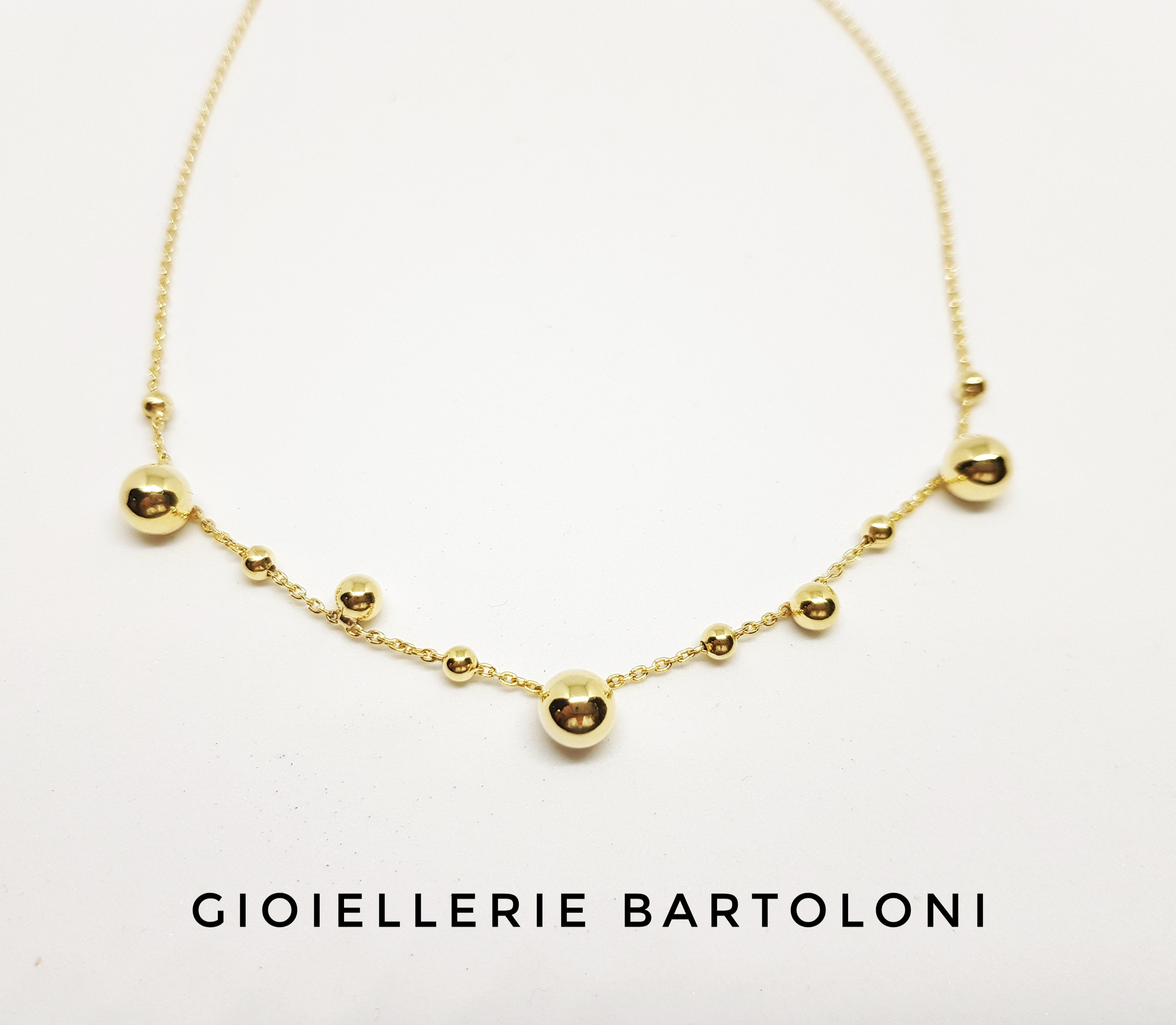 Collana OSA in argento dorato con boule pendenti