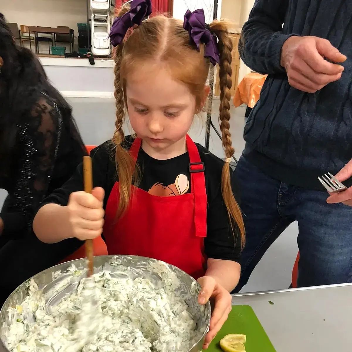 Food preparation during the cookery class