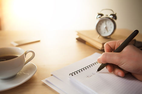 male-hand-with-pen-taking-notes