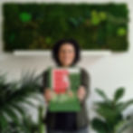 Paola Di Legge from Ninfa Studio holding 99 green ideas book