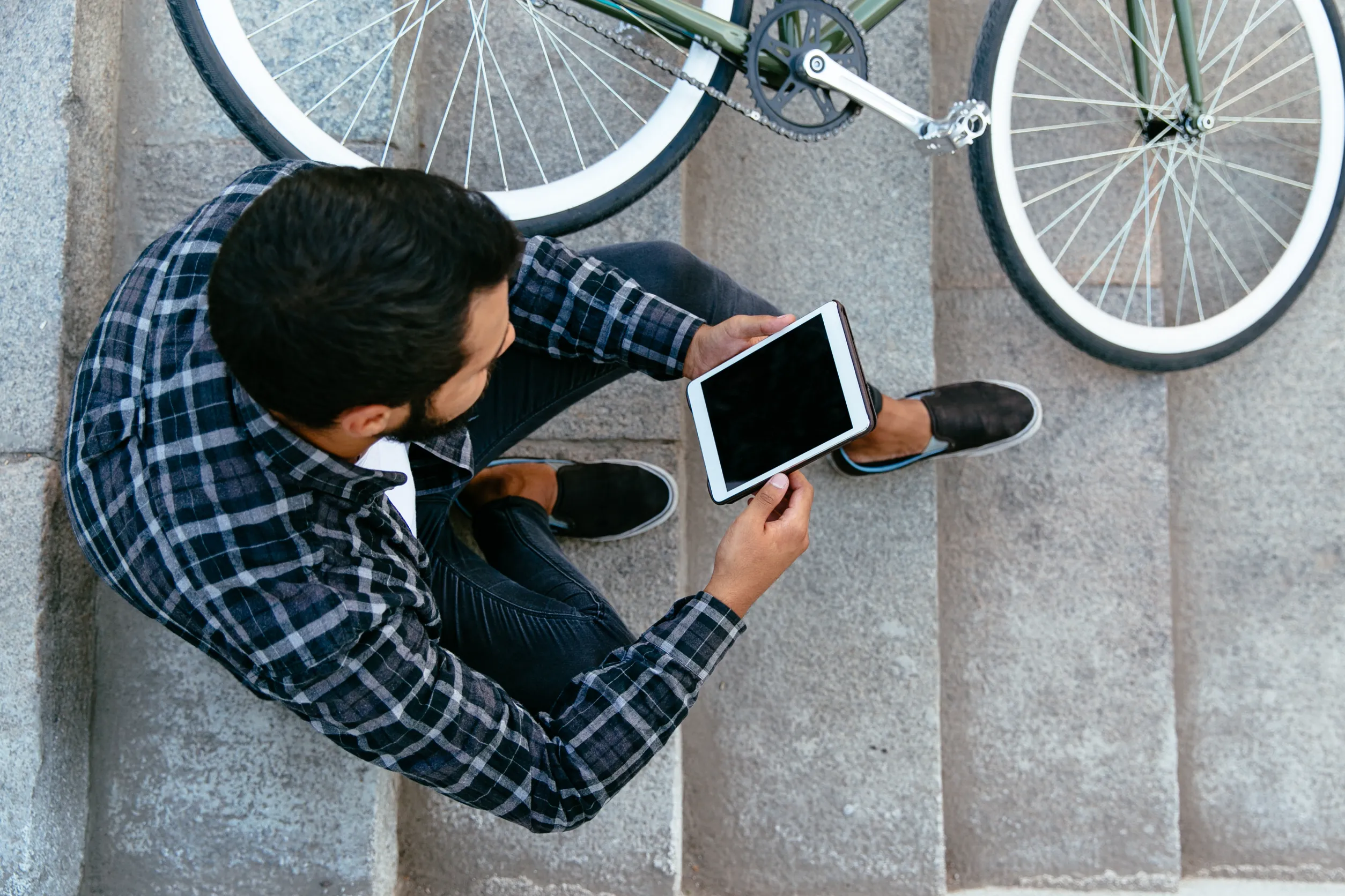 man reading next to bike.webp