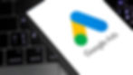 Close up shot of Google Ads logo on phone, on top of computer keyboard