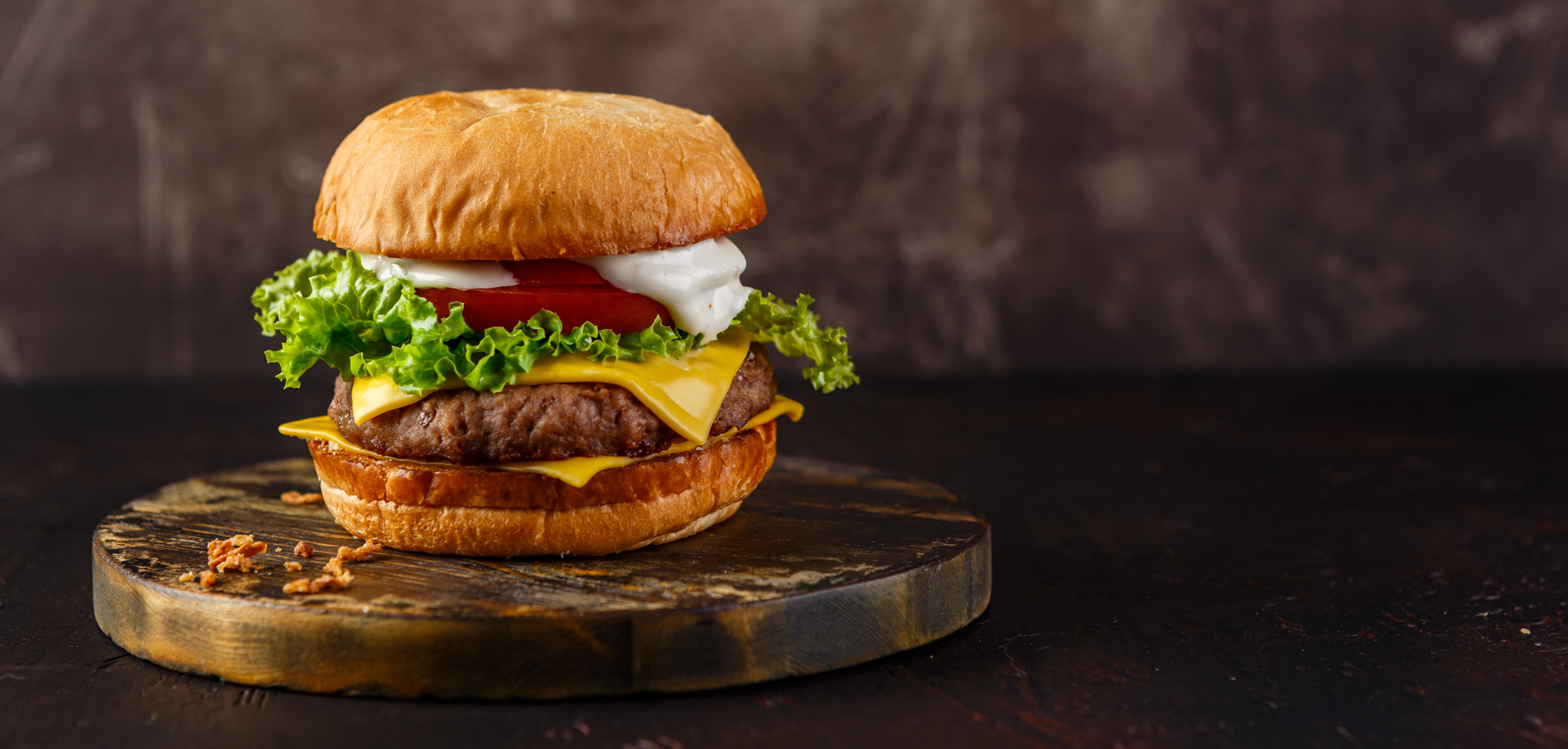 delicious hamburger on a wood plate