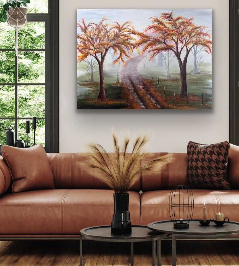 Wide angle view of a cozy living room with colorful art and autumn decor