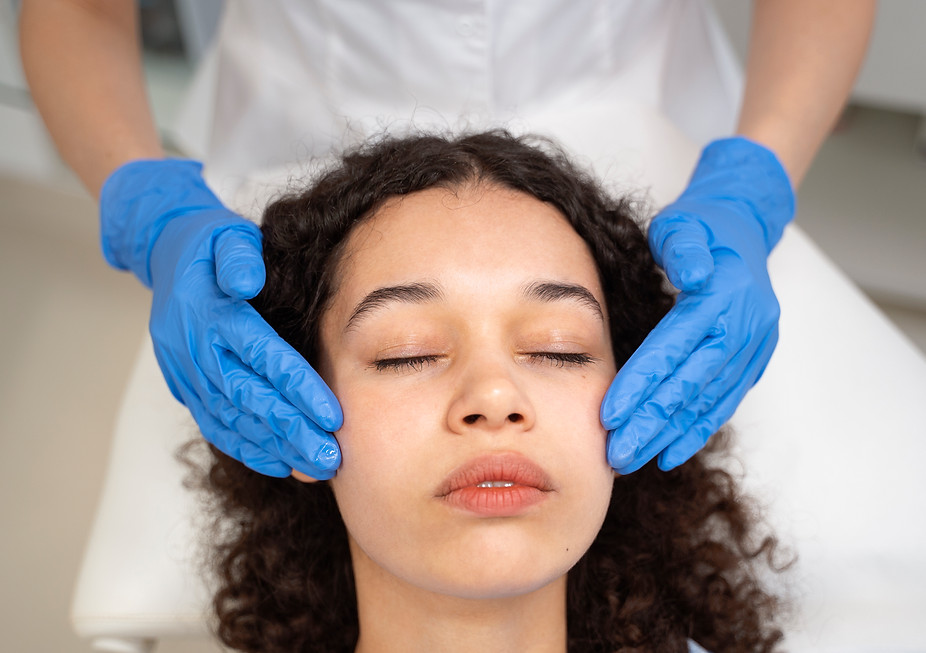 Woman receiving a facial treatment