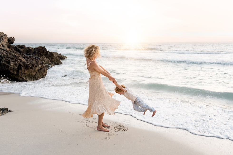 A mum and son playing on a beach in Watermans Bay, Perth