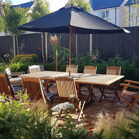 View of garden table surrounded by planting