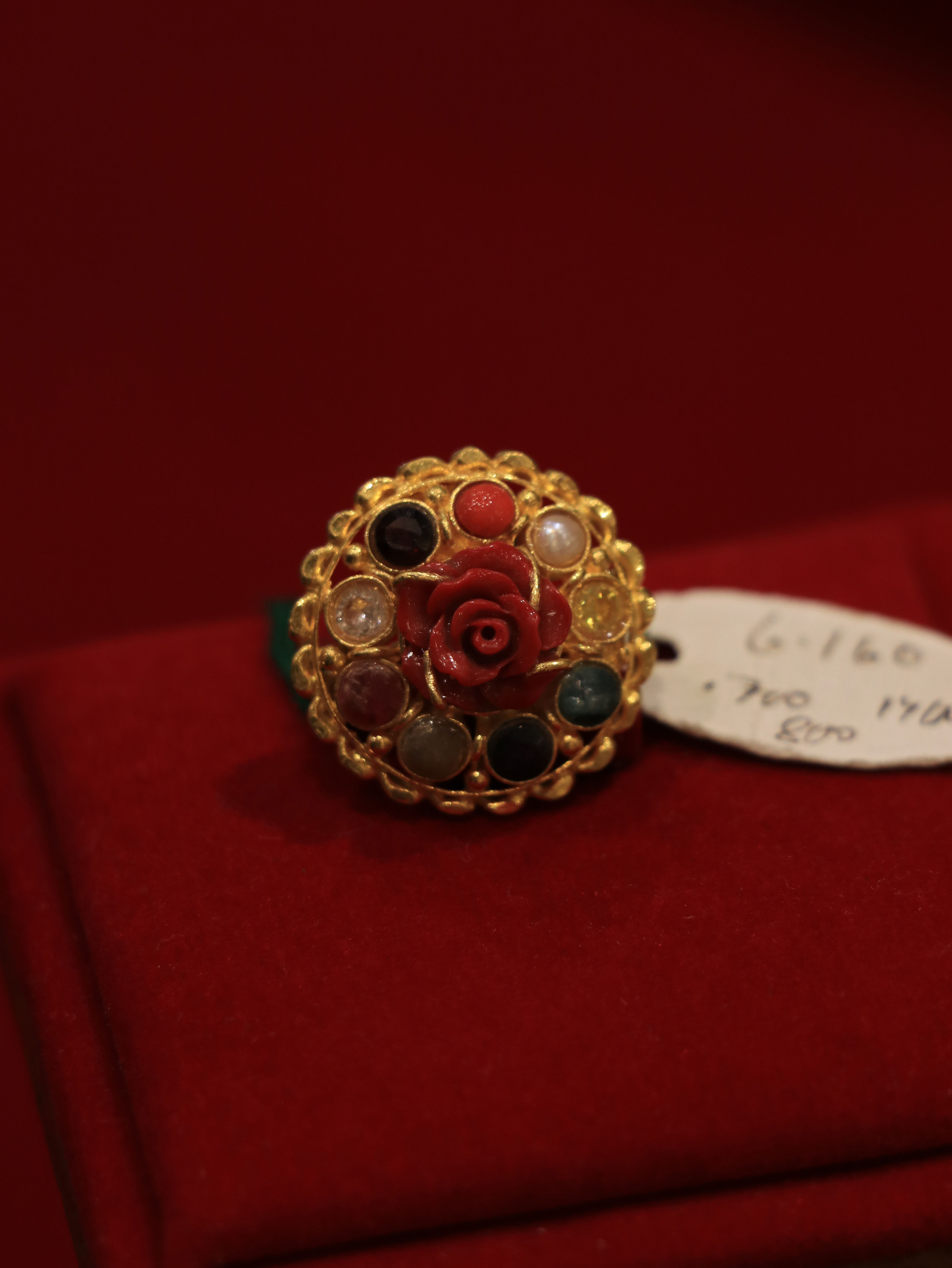 Sophisticated navratna rose munga gold ring featuring vibrant stones and rose coral detailing