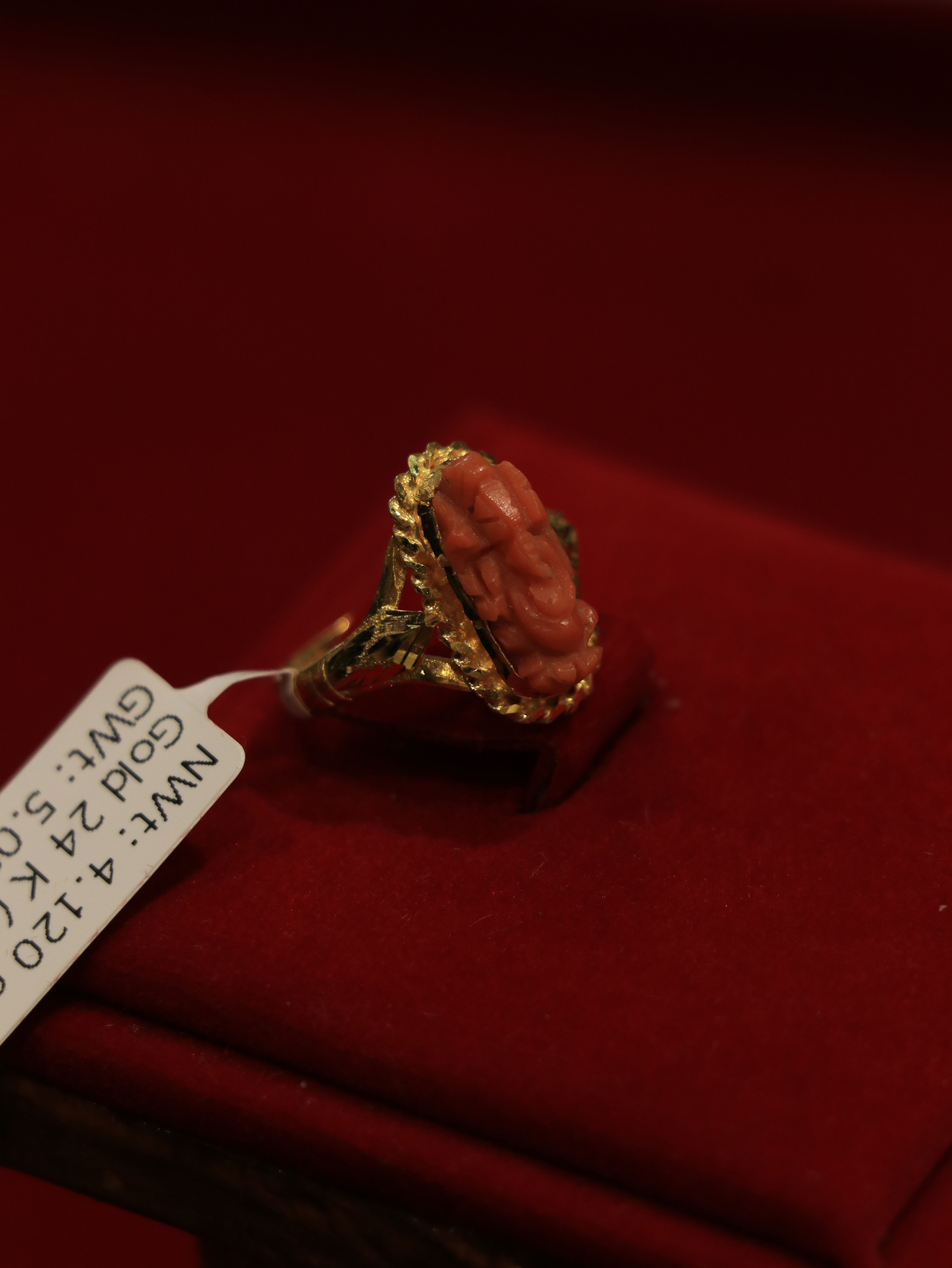 Elegant 24k ganesh munga gold ring with detailed Ganesh motif and coral accents