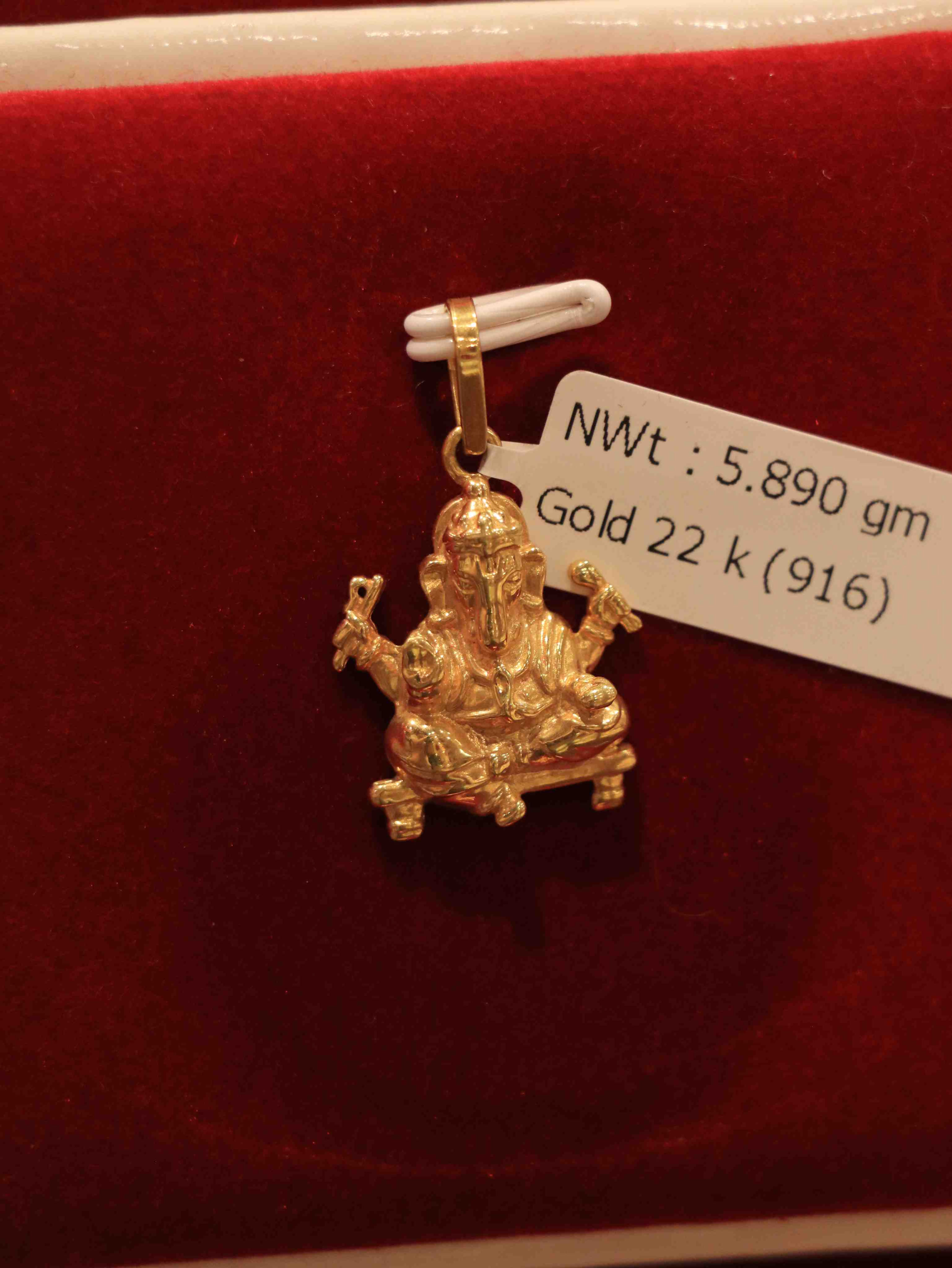 Premium Gold Ganesh Locket showcasing intricate 22K design for daily wear