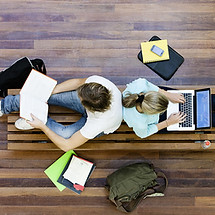 Male and female students doing schoolwor