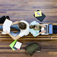Male and female students doing schoolwor
